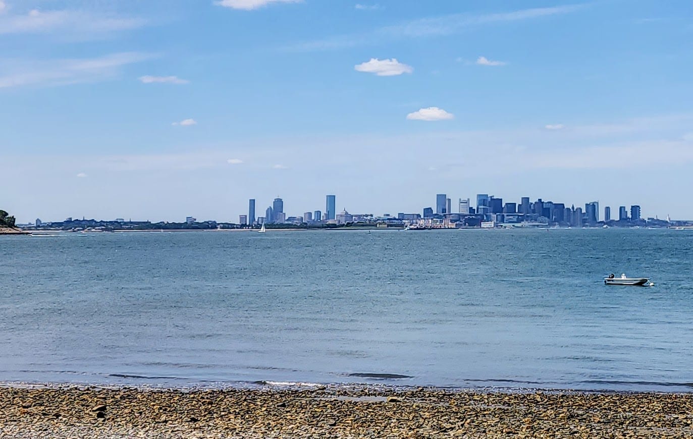 View from a Harbor Islands ferry with the Boston skyline in the distance on a summer afternoon.