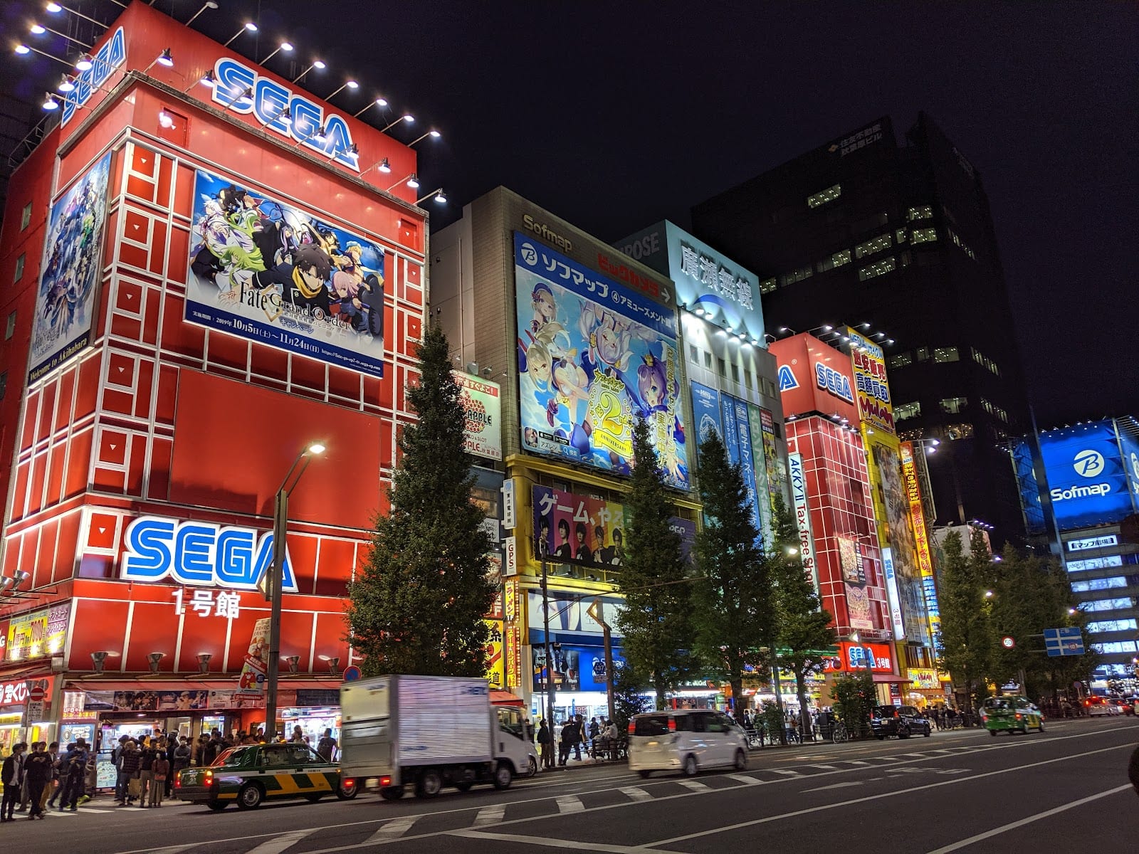 The towers of Akihabara's arcades lit along Chuo-dori at dusk.