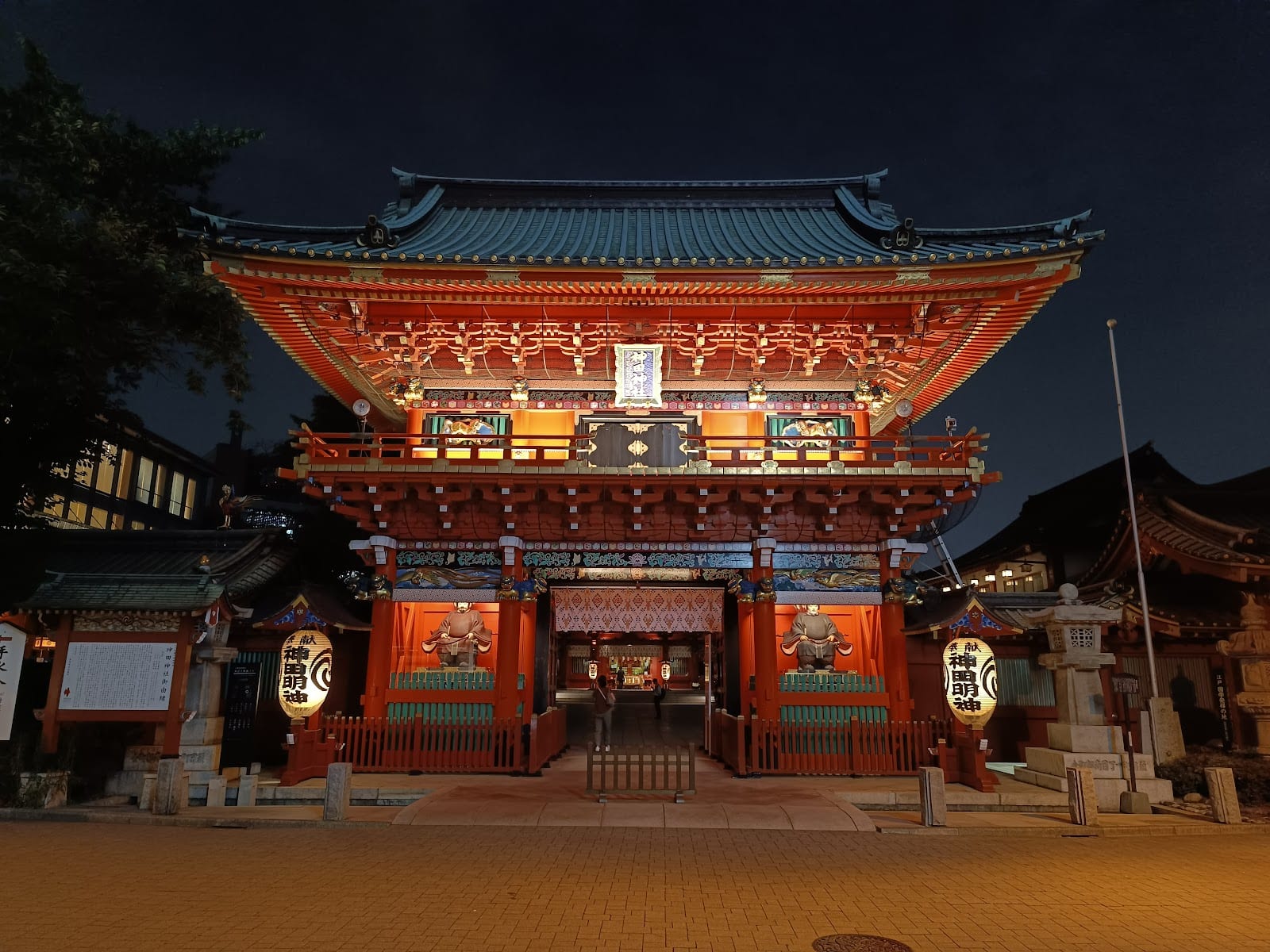 The Zuishinmon gate of Kanda Myojin lit at dusk.