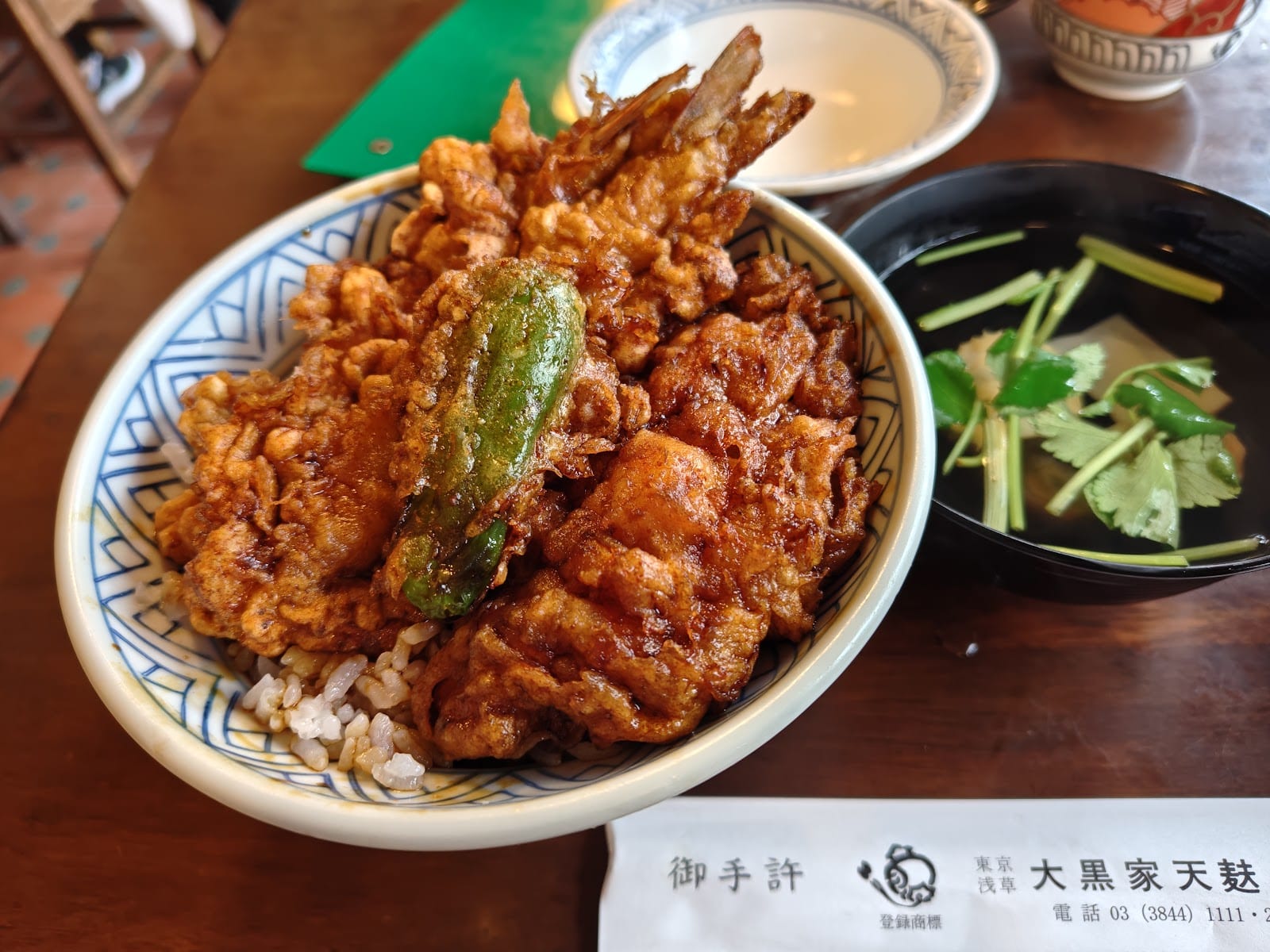 Daikokuya's tendon: tempura over rice in a dark sesame-oil sauce.