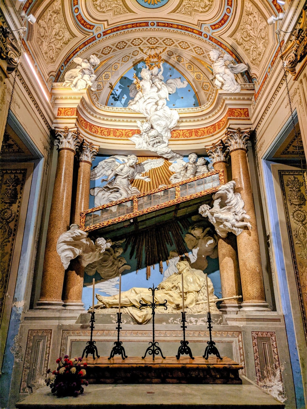 The reliquary of St Alexius's wooden staircase held aloft by carved angels.