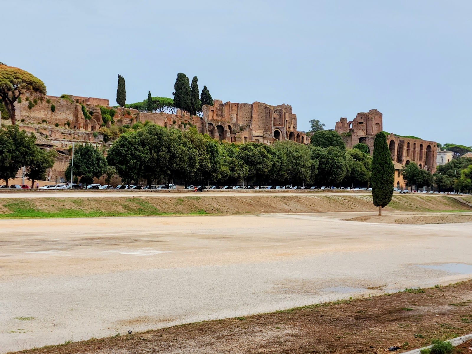 The wide grassy oval of the Circus Maximus with the Palatine behind.