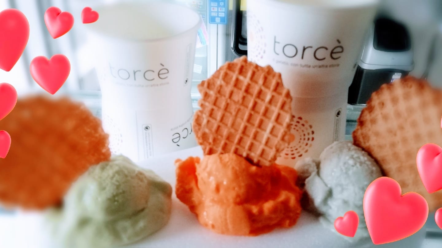Scoops of gelato with waffle cones at Torcè.