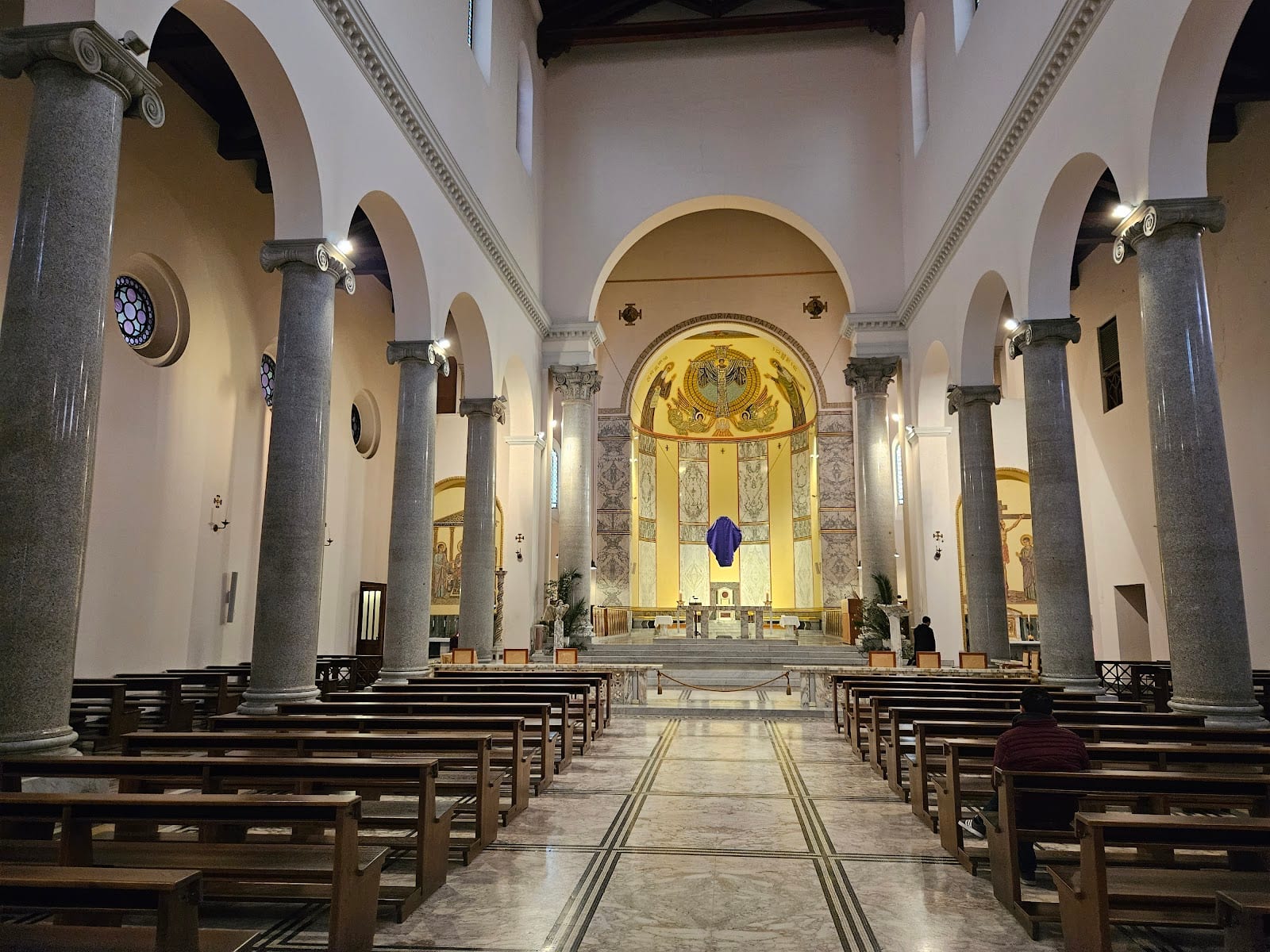 The neo-Romanesque nave and golden apse of Sant'Anselmo on the Aventine.