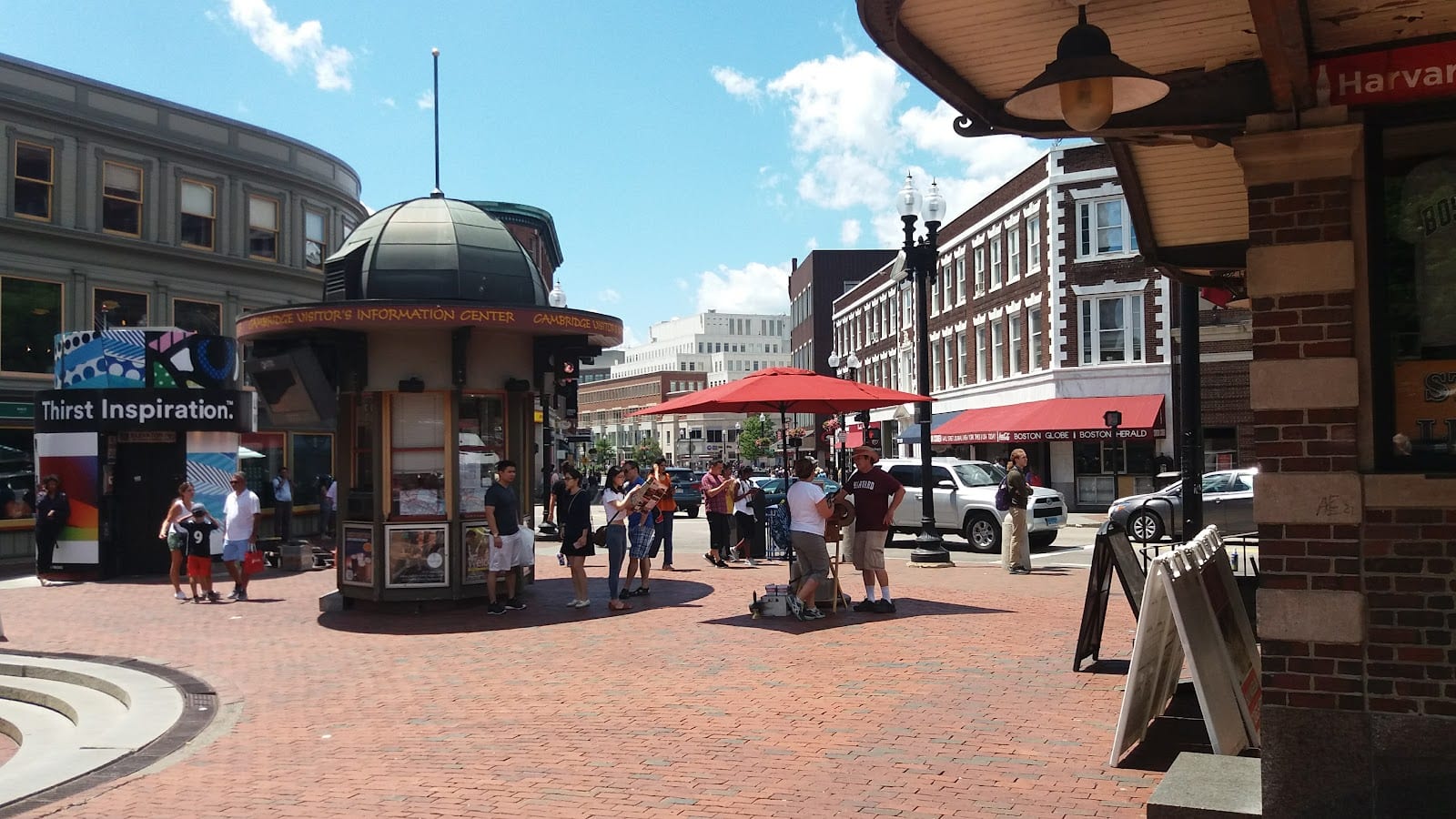 Harvard Square street scene with shops and pedestrians.