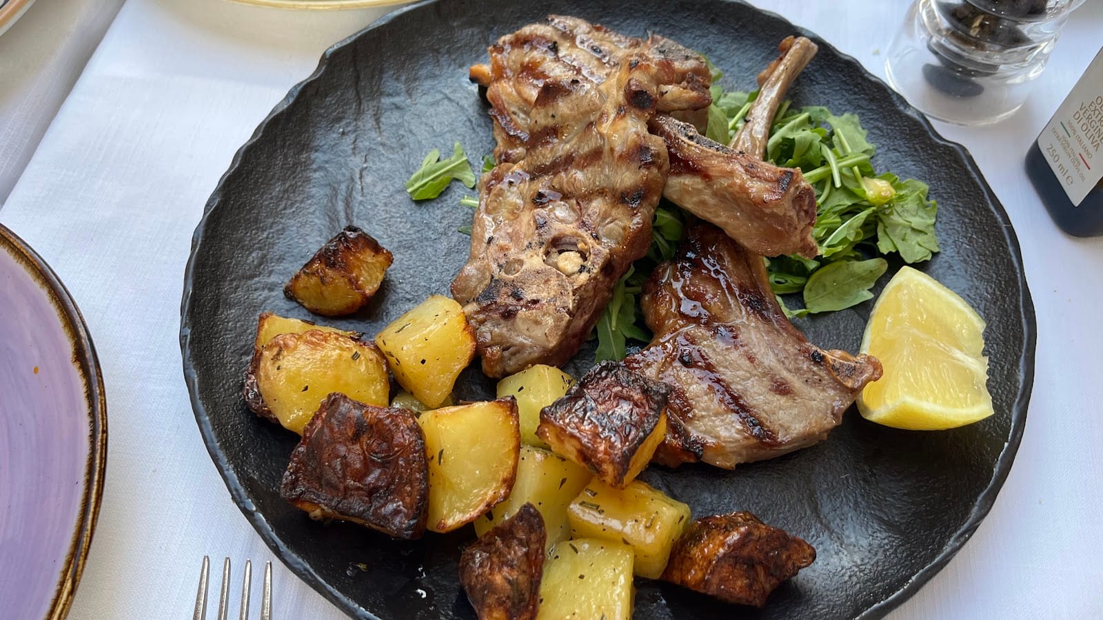 Grilled lamb chops with roast potatoes at Ba'Ghetto.