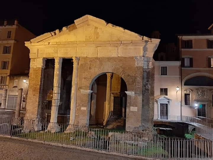 The Portico d'Ottavia floodlit at night in the Jewish Ghetto.