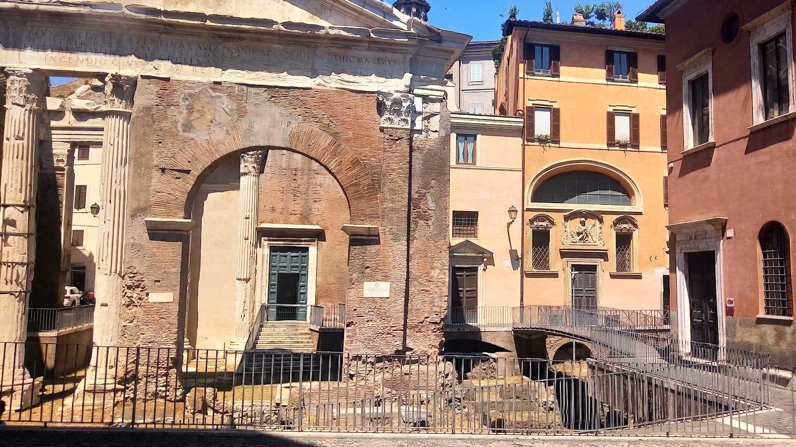 The great arch of the Portico d'Ottavia among the Ghetto's buildings.