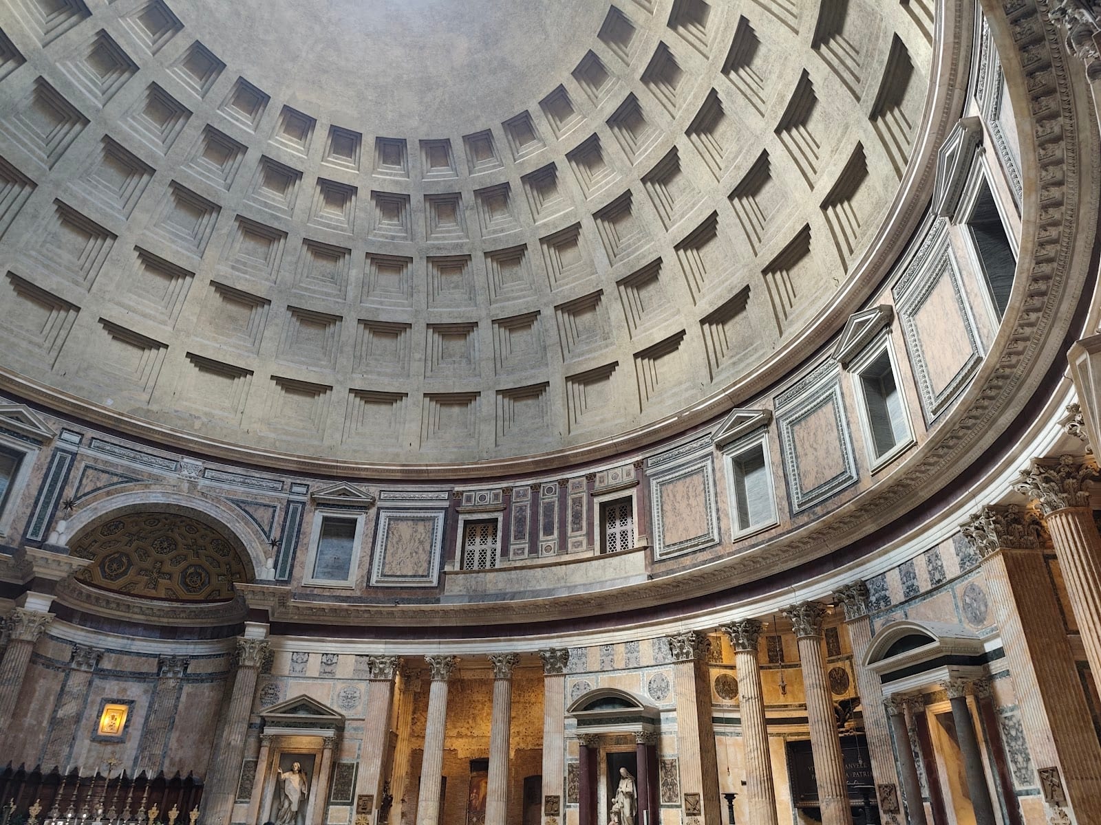 The coffered dome and open oculus inside the Pantheon.
