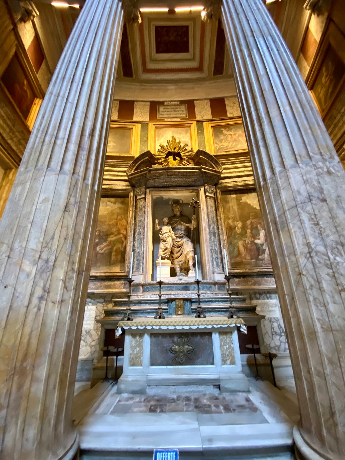 A statue in one of the marble niches inside the Pantheon.