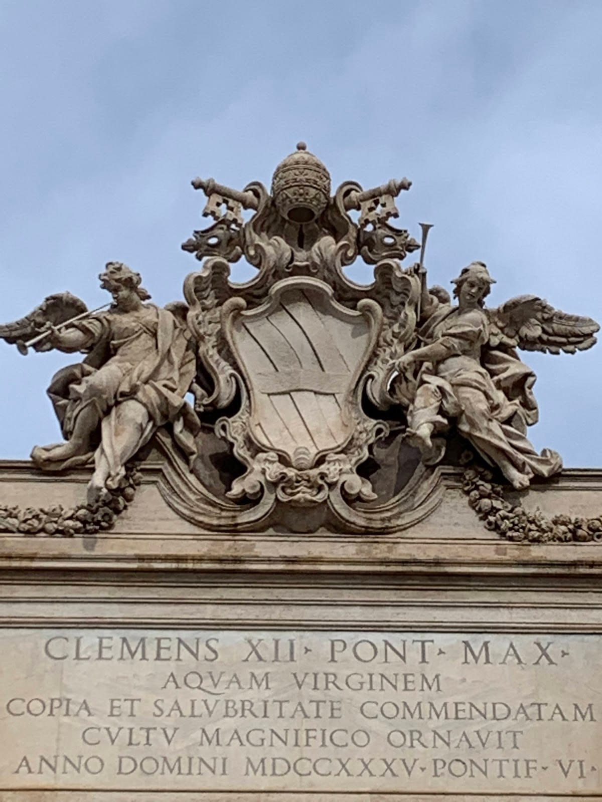The carved allegorical figures on the attic of the Trevi Fountain.