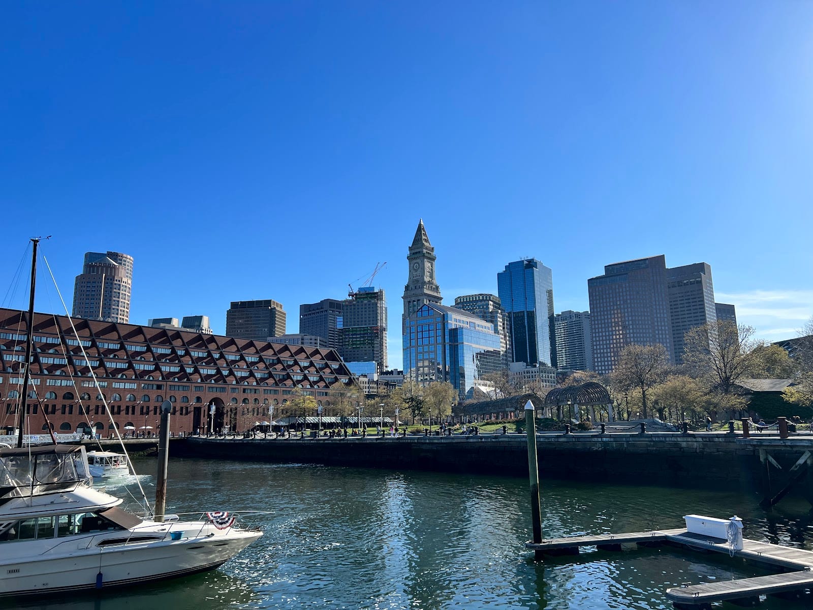 Charlestown Harborwalk with Boston skyline in the background.