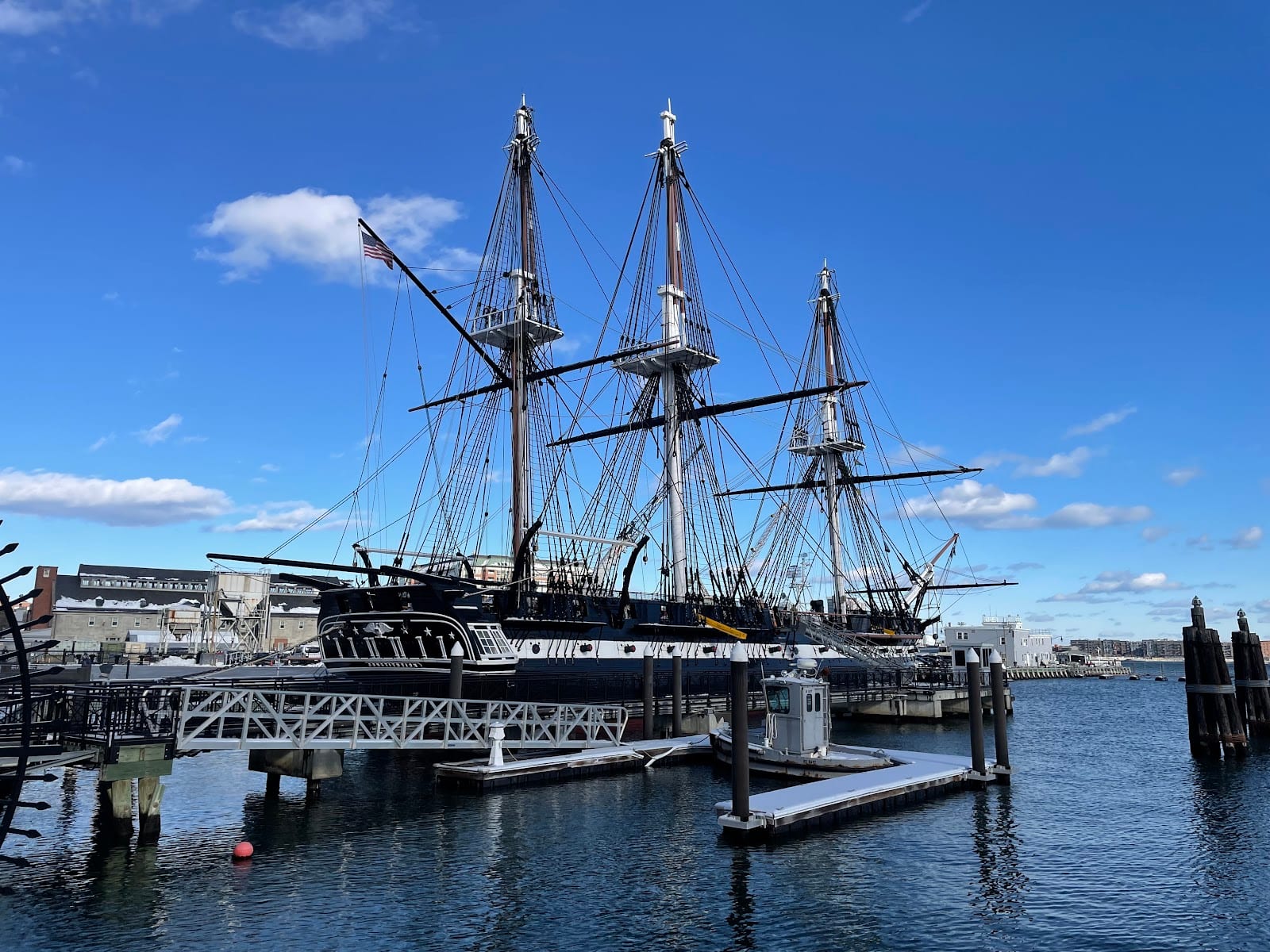 Charlestown Navy Yard waterfront with historic buildings and harbor views.