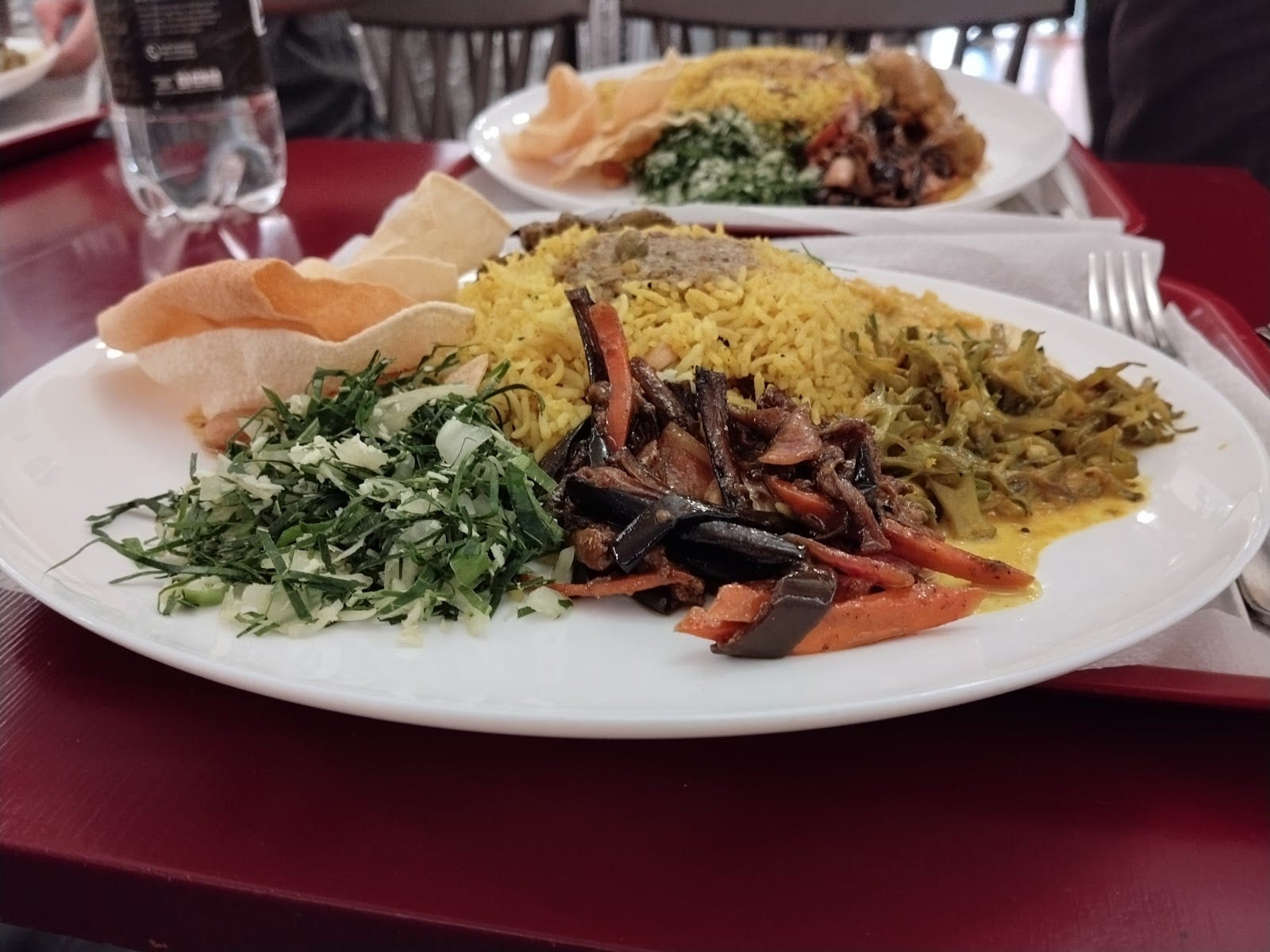 A plate of Sri Lankan rice and curry with spiced meat at 7 Seven Lanka in Rome.