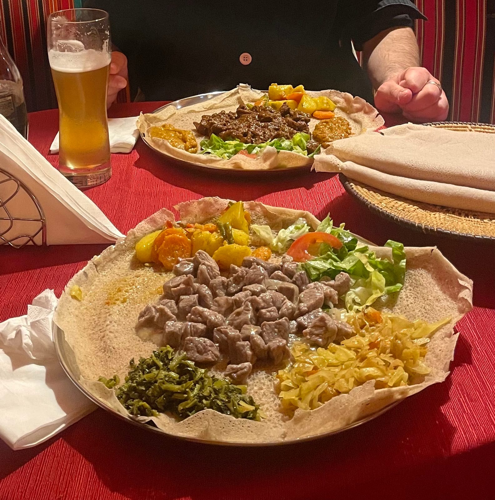 A shared injera platter of meat and vegetable stews at Africa Restaurant.
