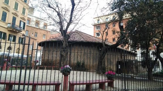 The Auditorium of Maecenas pavilion behind railings in its garden.