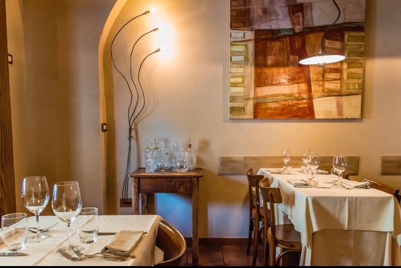 The white-tablecloth dining room of Trattoria Monti.