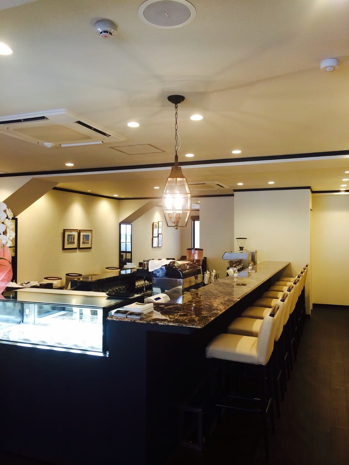 The warm-lit interior of Cafe Paulista.