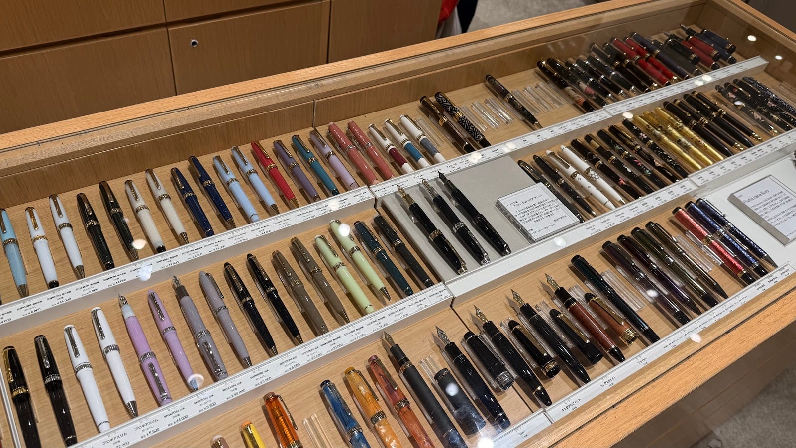 A wall of fountain pens inside Itoya.