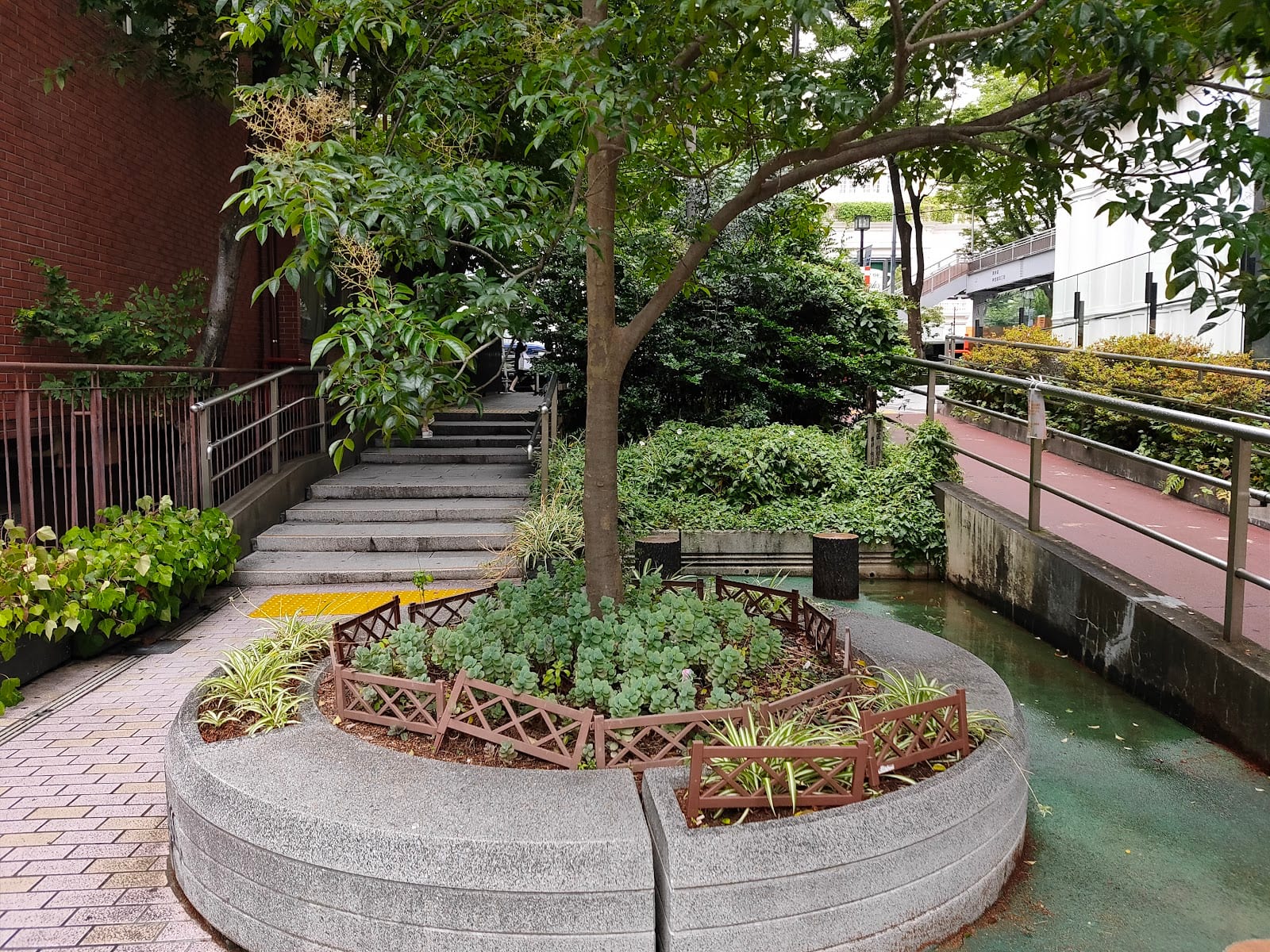 A leafy, planted stretch of Cat Street on the old riverbed.