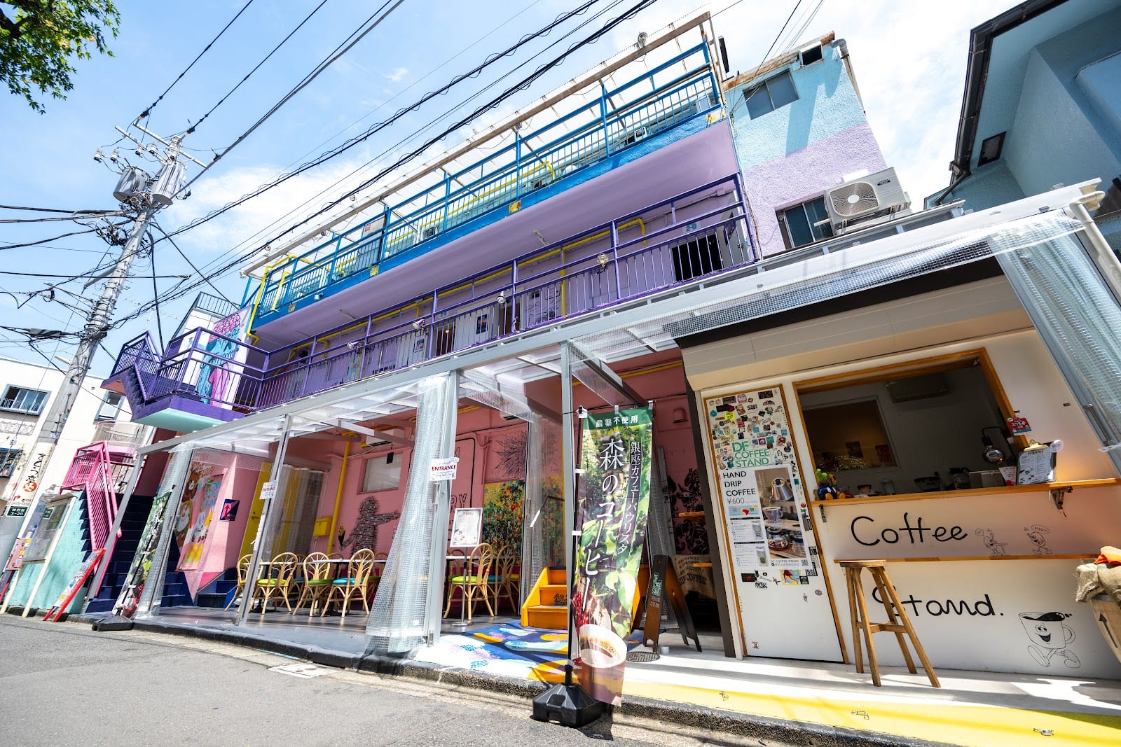 A painted gallery building and coffee stand at Design Festa.