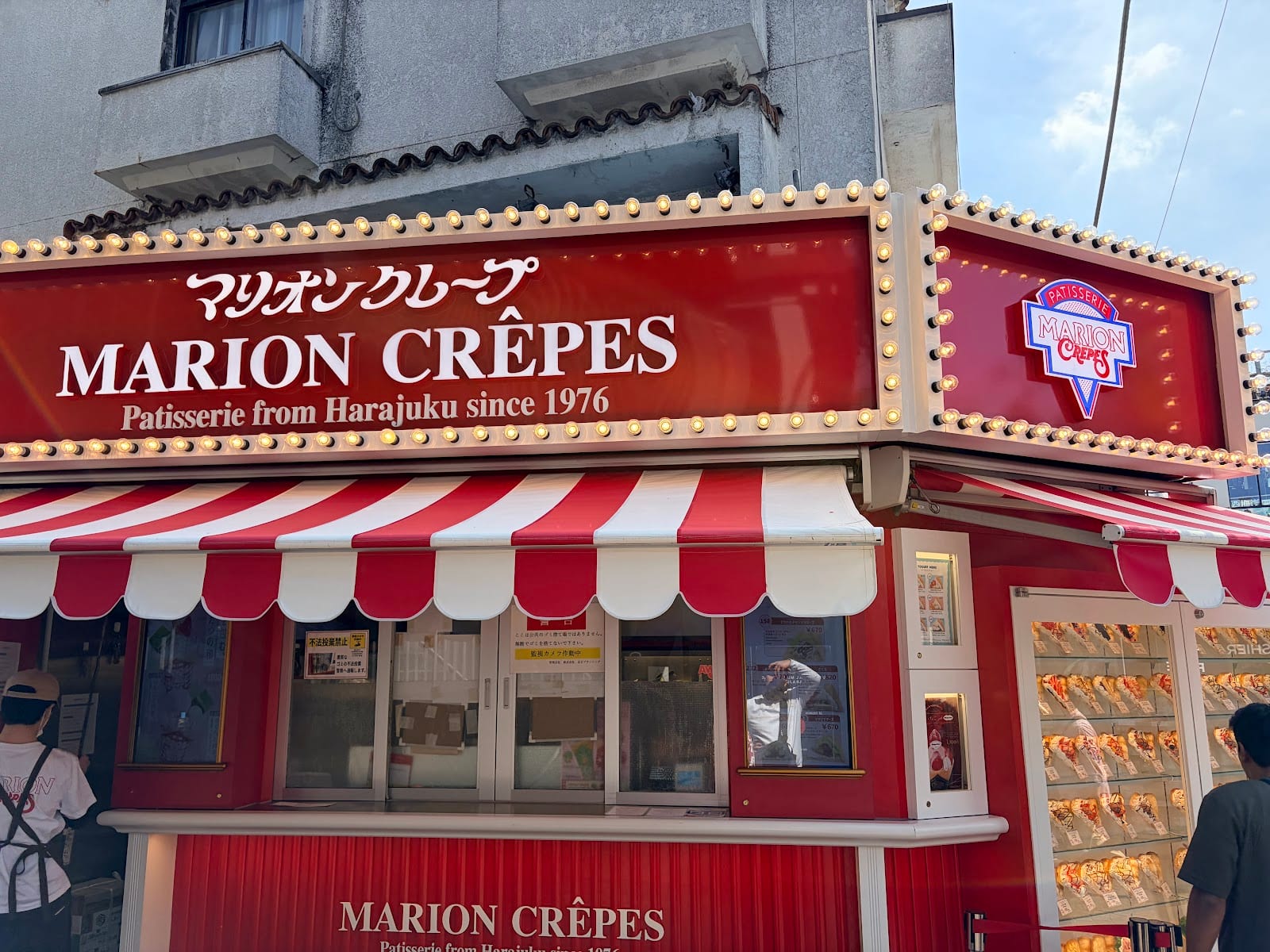 The striped Marion Crepes storefront on Takeshita Street.