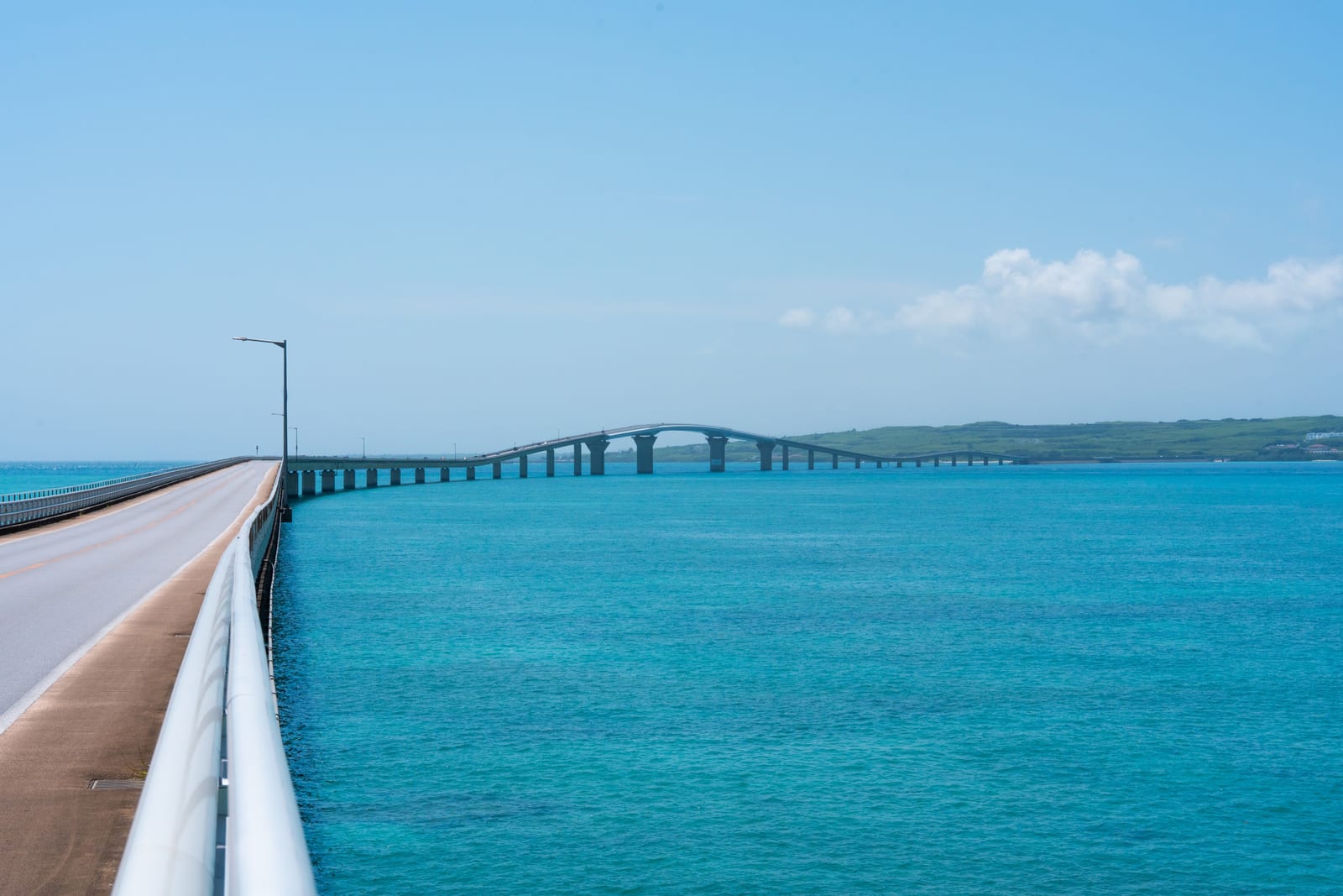 Irabu Bridge crosses turquoise water between the islands of Miyakojima and Irabu.