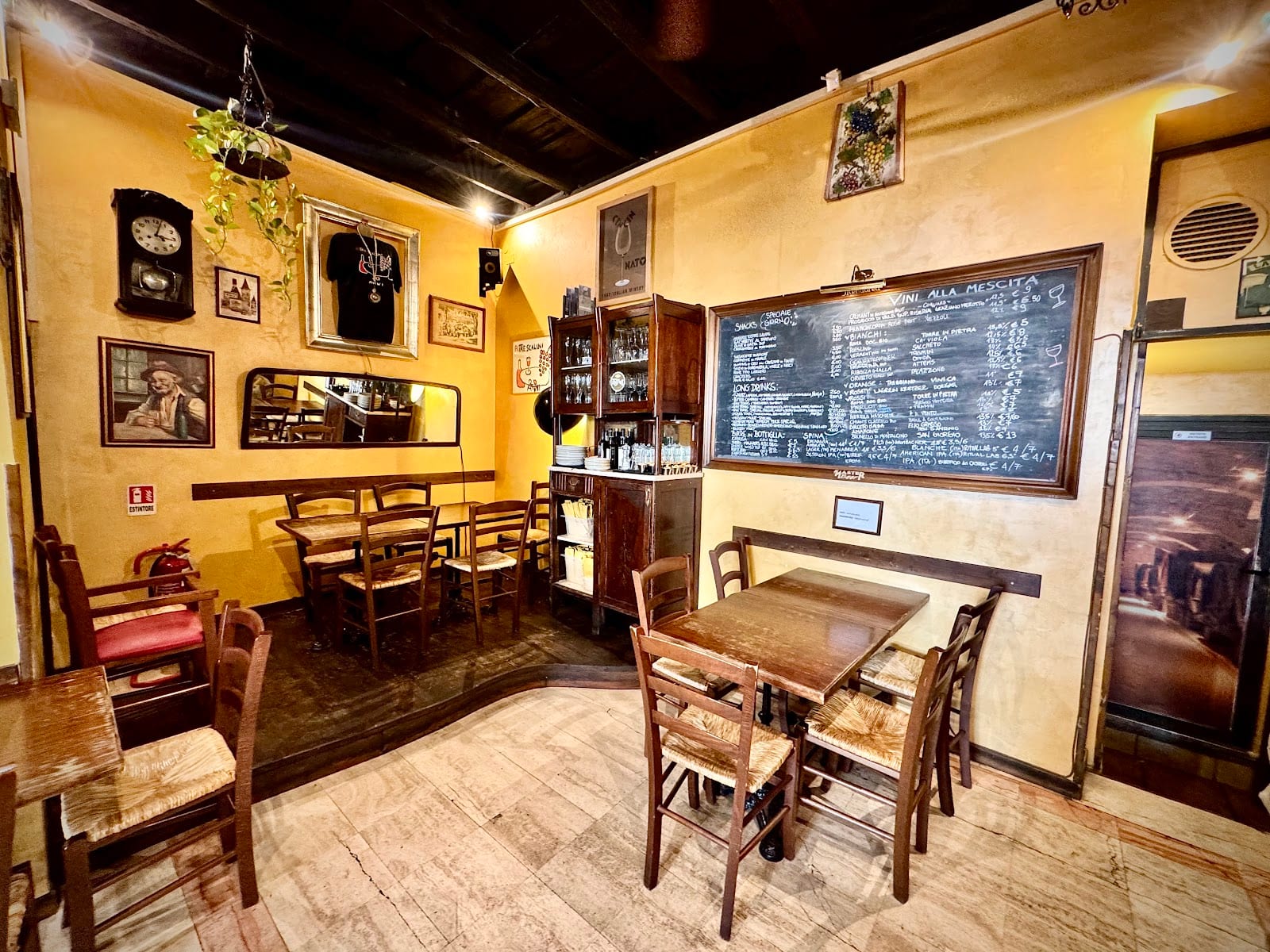 The cozy interior of Ai Tre Scalini with its chalkboard menu.