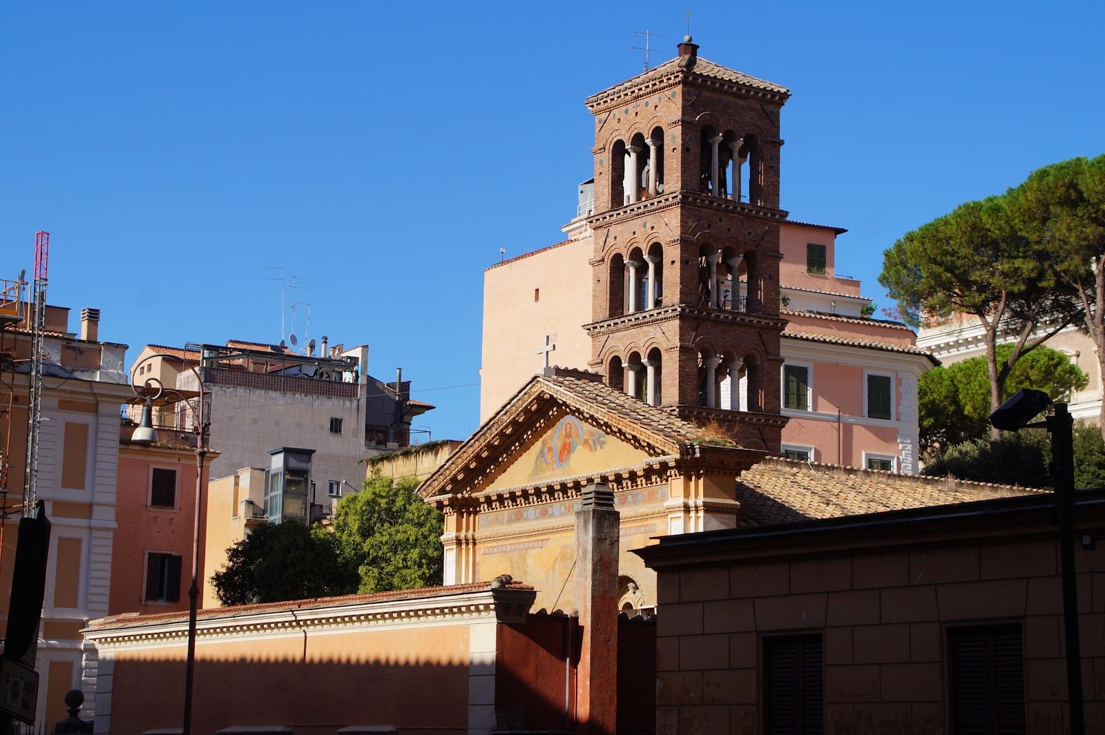 The medieval bell tower of Santa Pudenziana rising above the rooftops.