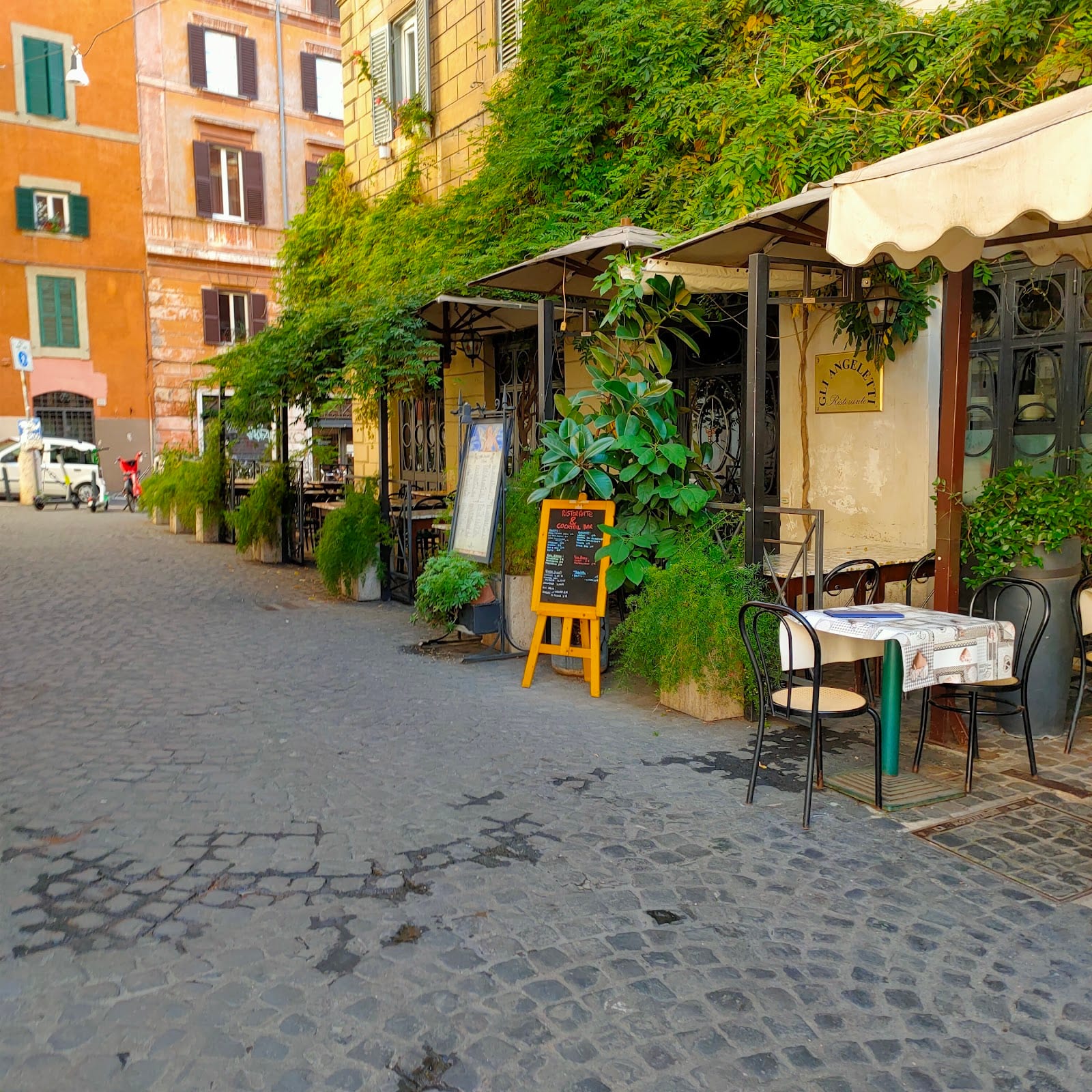A leafy trattoria on a cobbled street in Monti, Rome.