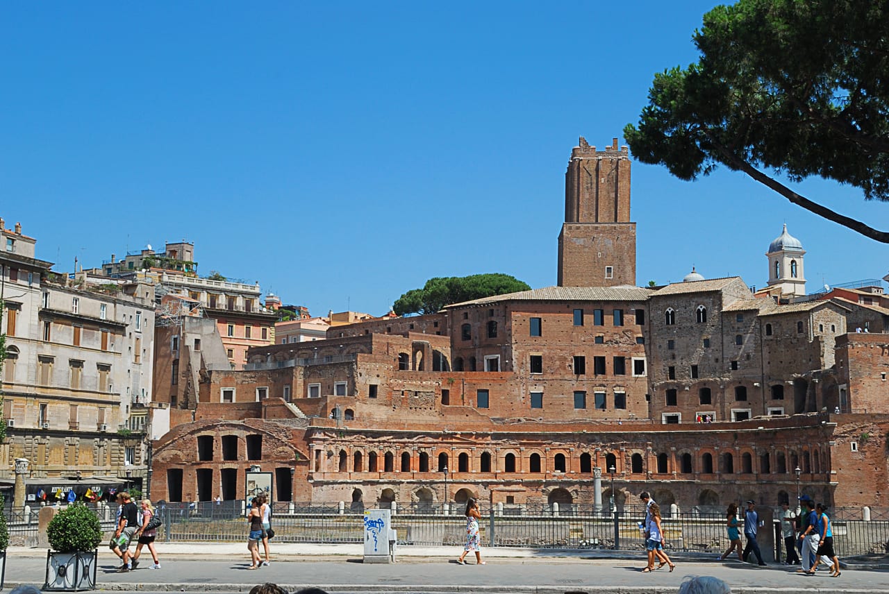 The tiered brick ranks of Trajan's Market beneath the Torre delle Milizie.