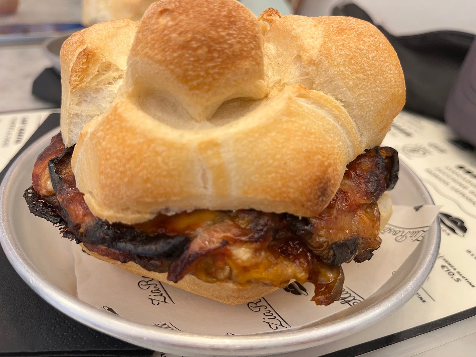 A filled rosetta sandwich on a branded plate at Zia Rosetta.