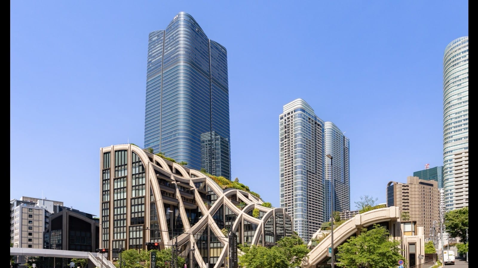 Azabudai Hills, with the Mori JP Tower and a sculptural garden pergola.