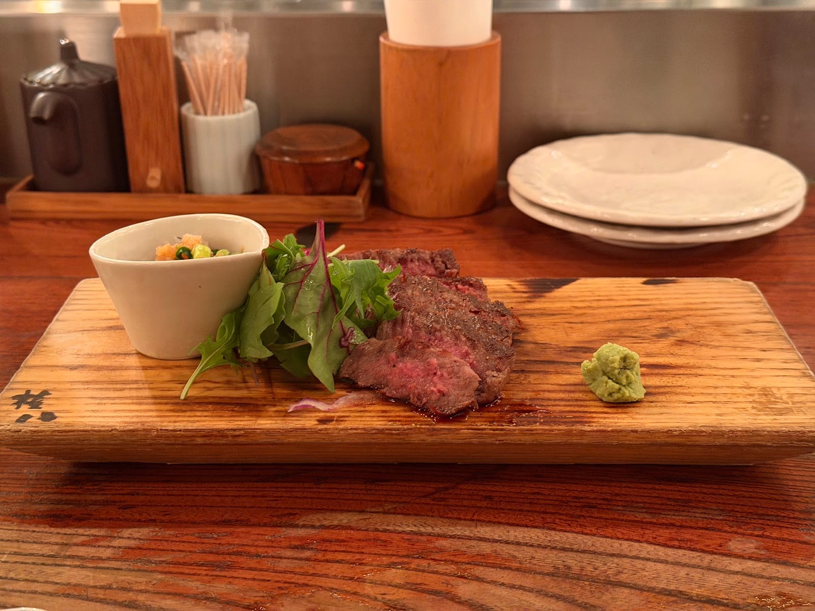 Seared beef with wasabi on a board at Gonpachi.