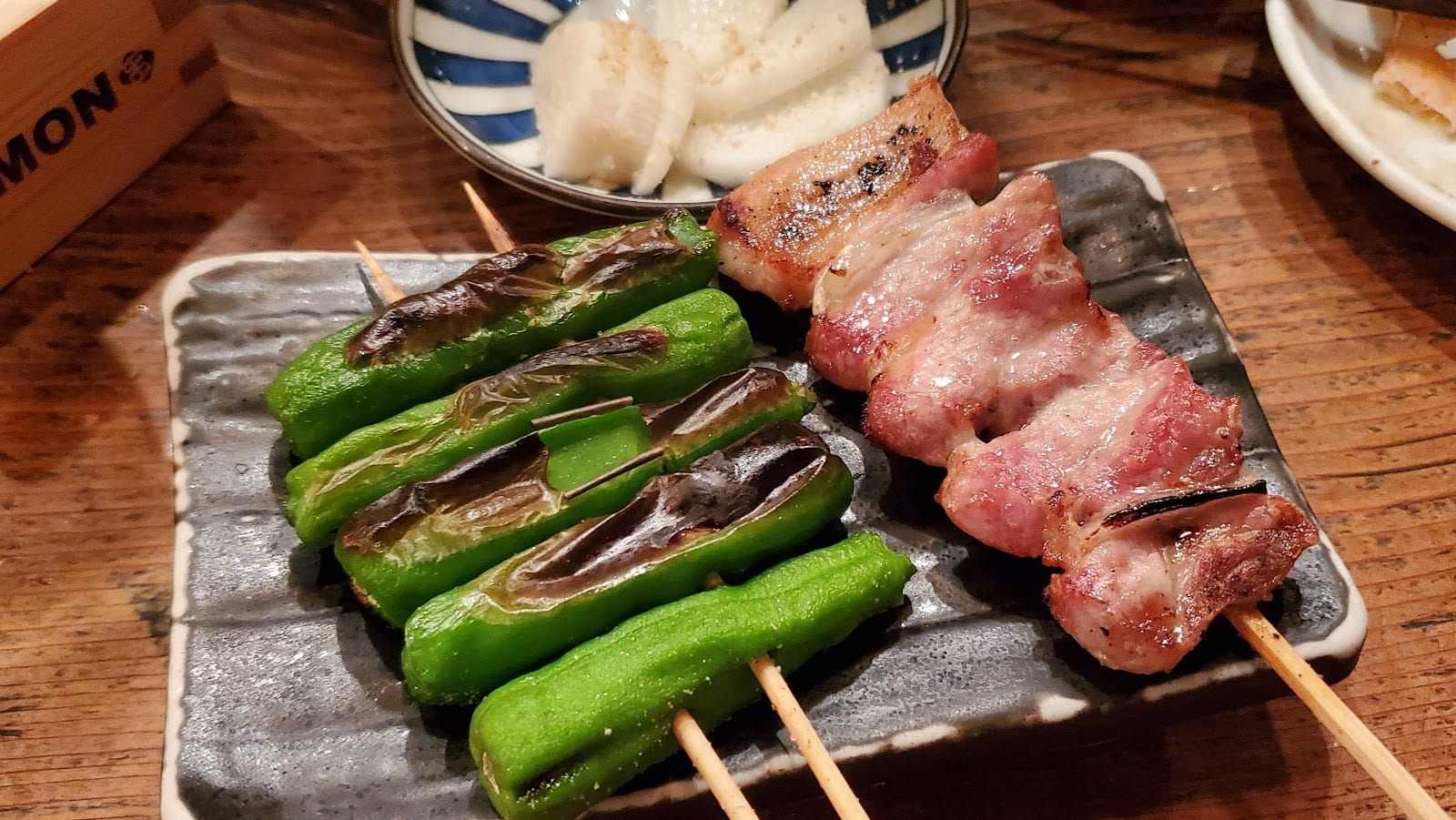 Charcoal-grilled skewers fresh off the grill at Jomon Roppongi.