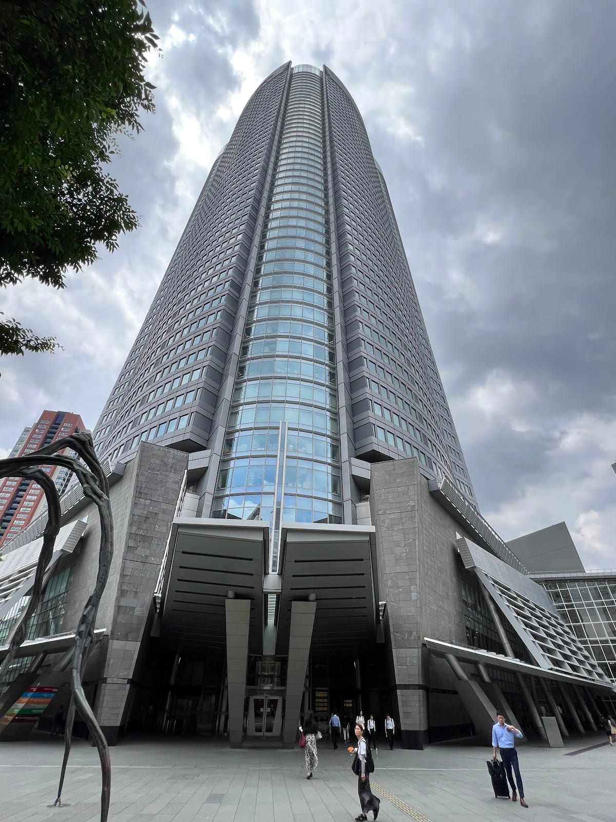 Looking up the glass face of the Mori Tower at Roppongi Hills.