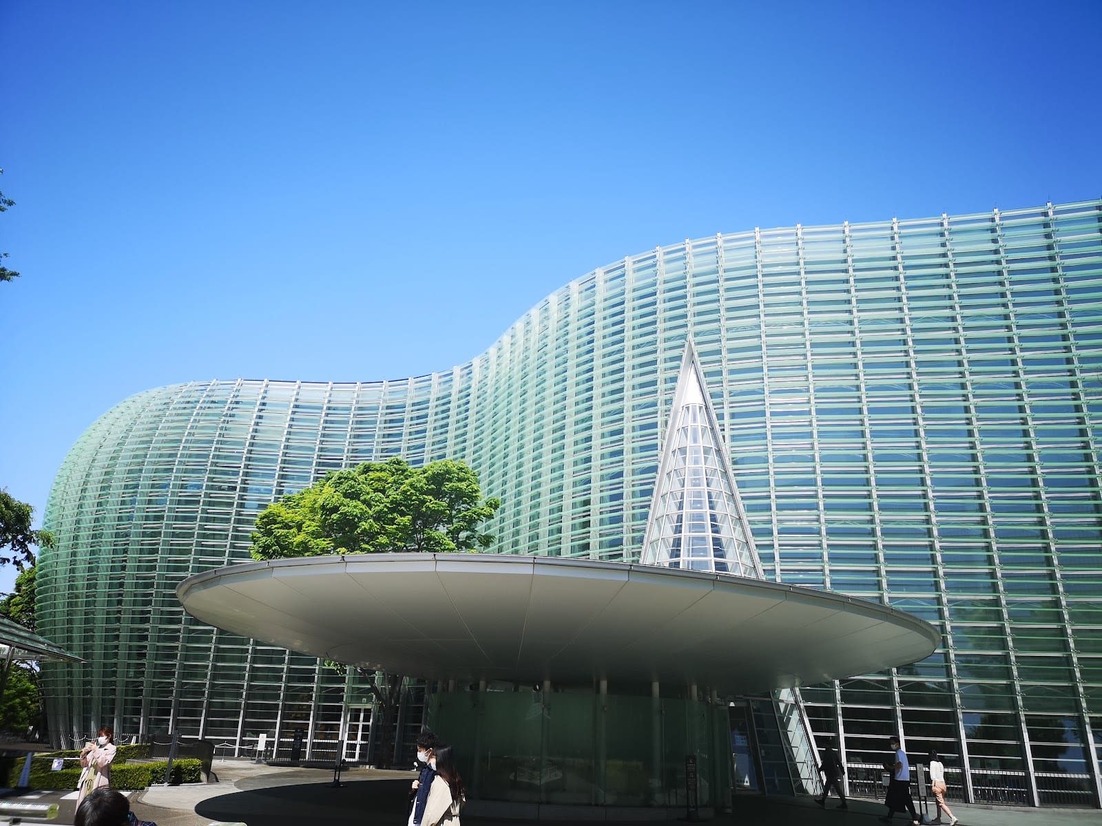 The rippling glass facade and conical entrance of the National Art Center.