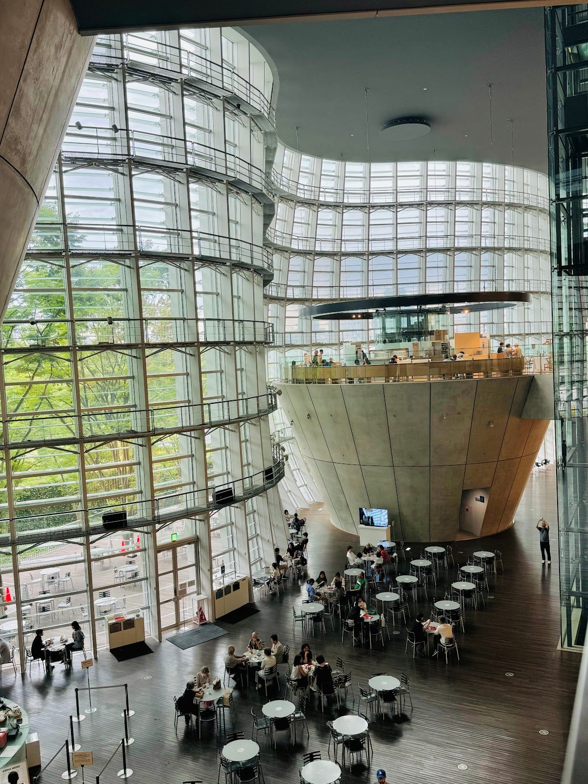 The inverted concrete cones and restaurant inside the National Art Center's atrium.
