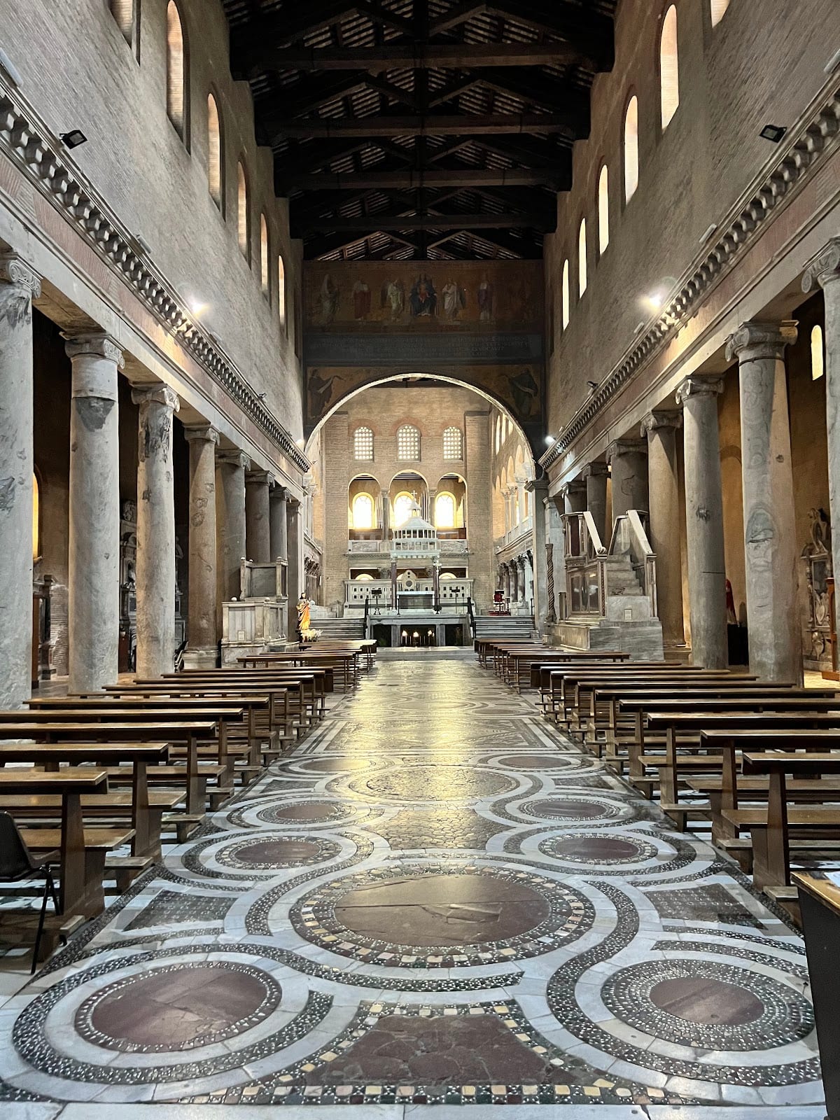 The ancient columned nave and cosmatesque floor inside San Lorenzo fuori le Mura.