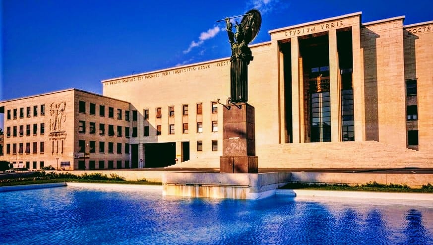 The Rettorato palace and the bronze Minerva statue in a reflecting pool at Sapienza.