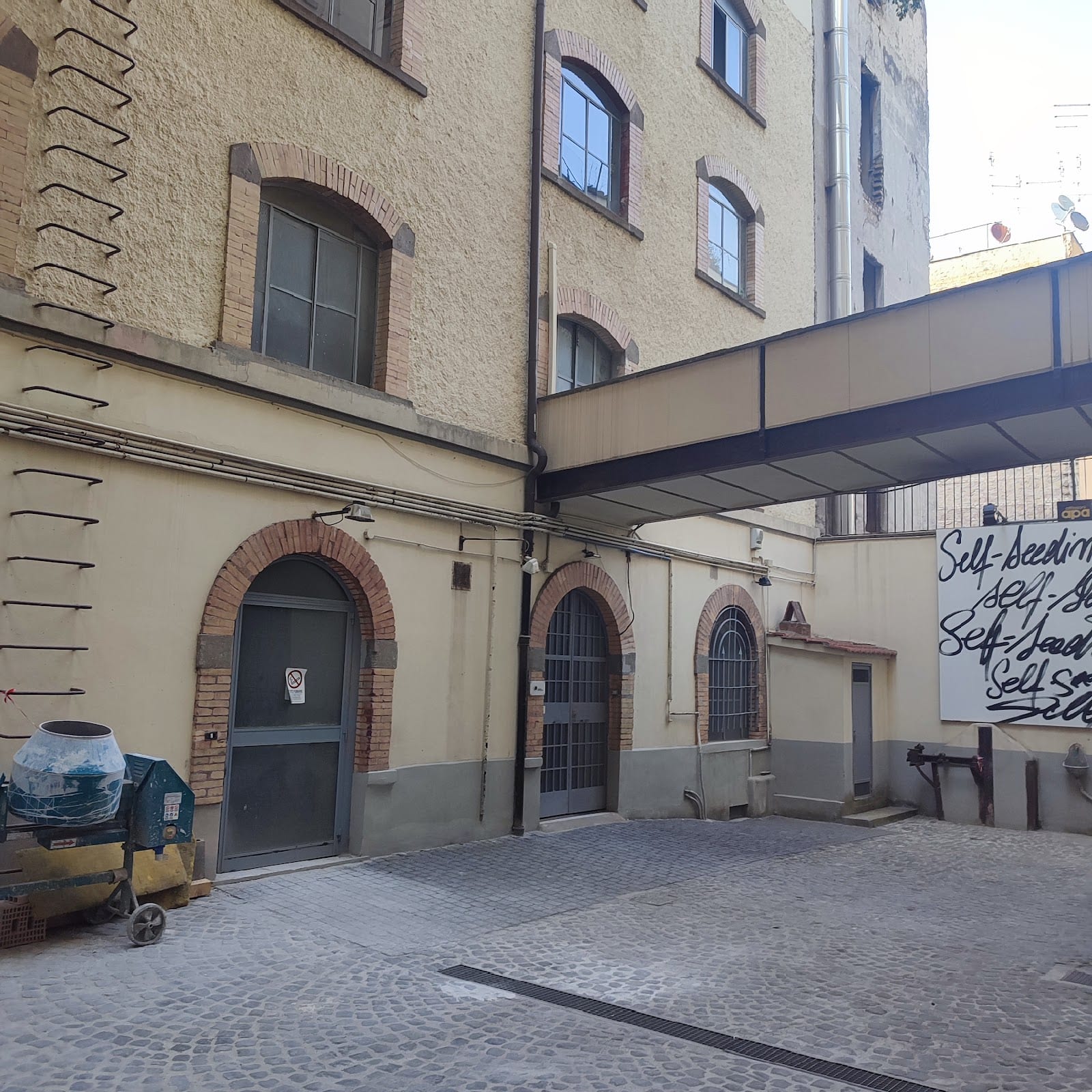 The industrial courtyard of the Fondazione Pastificio Cerere.