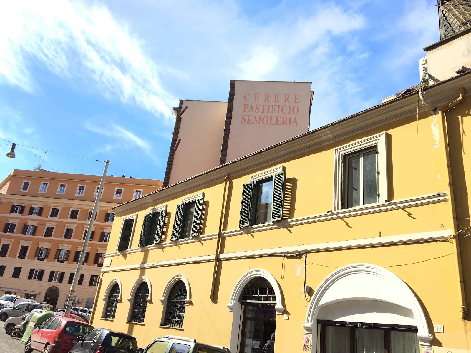 The yellow facade of the former Cerere pasta factory in San Lorenzo.