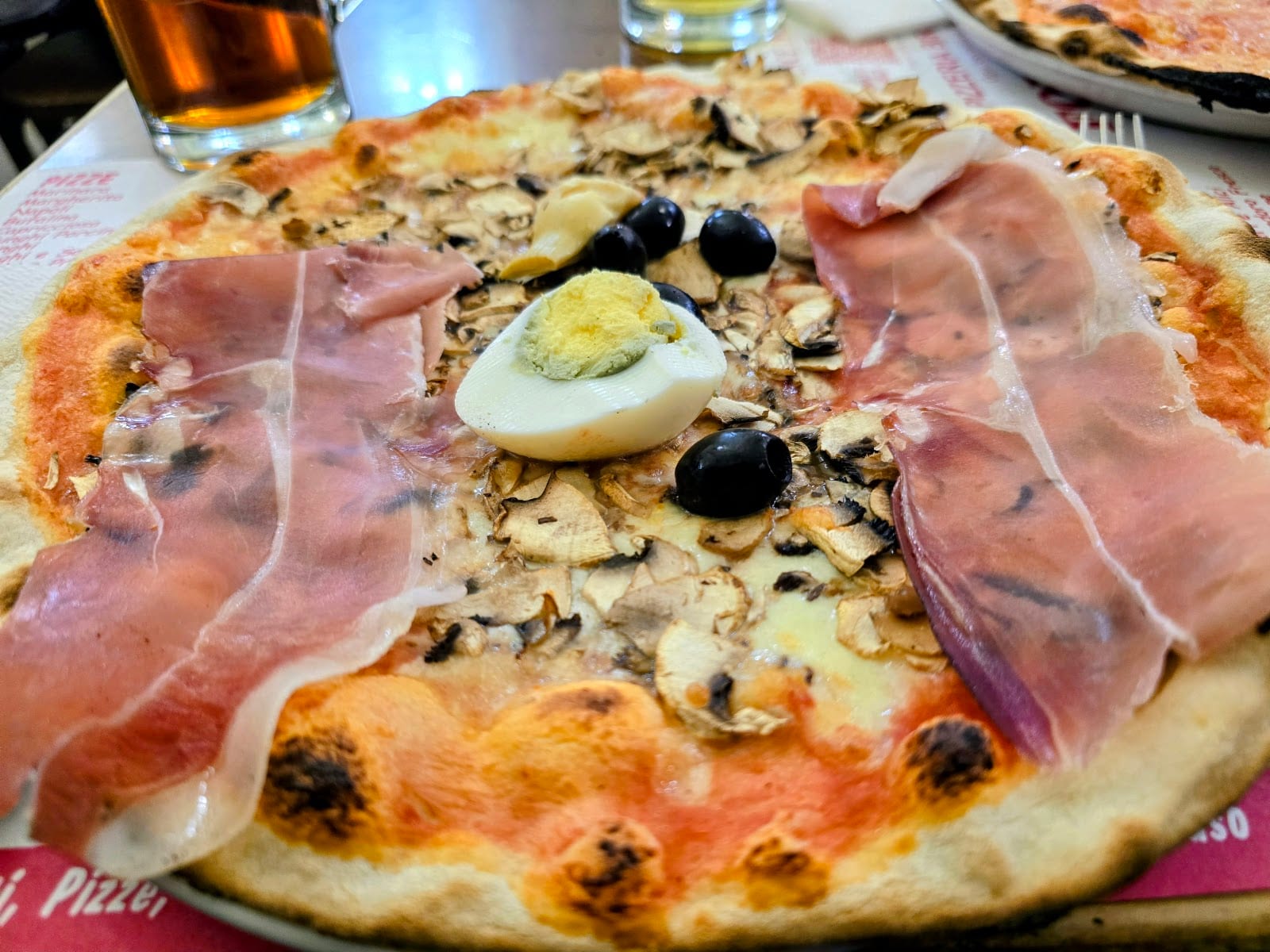 A thin-crust Roman pizza with prosciutto at Pizzeria Formula 1.