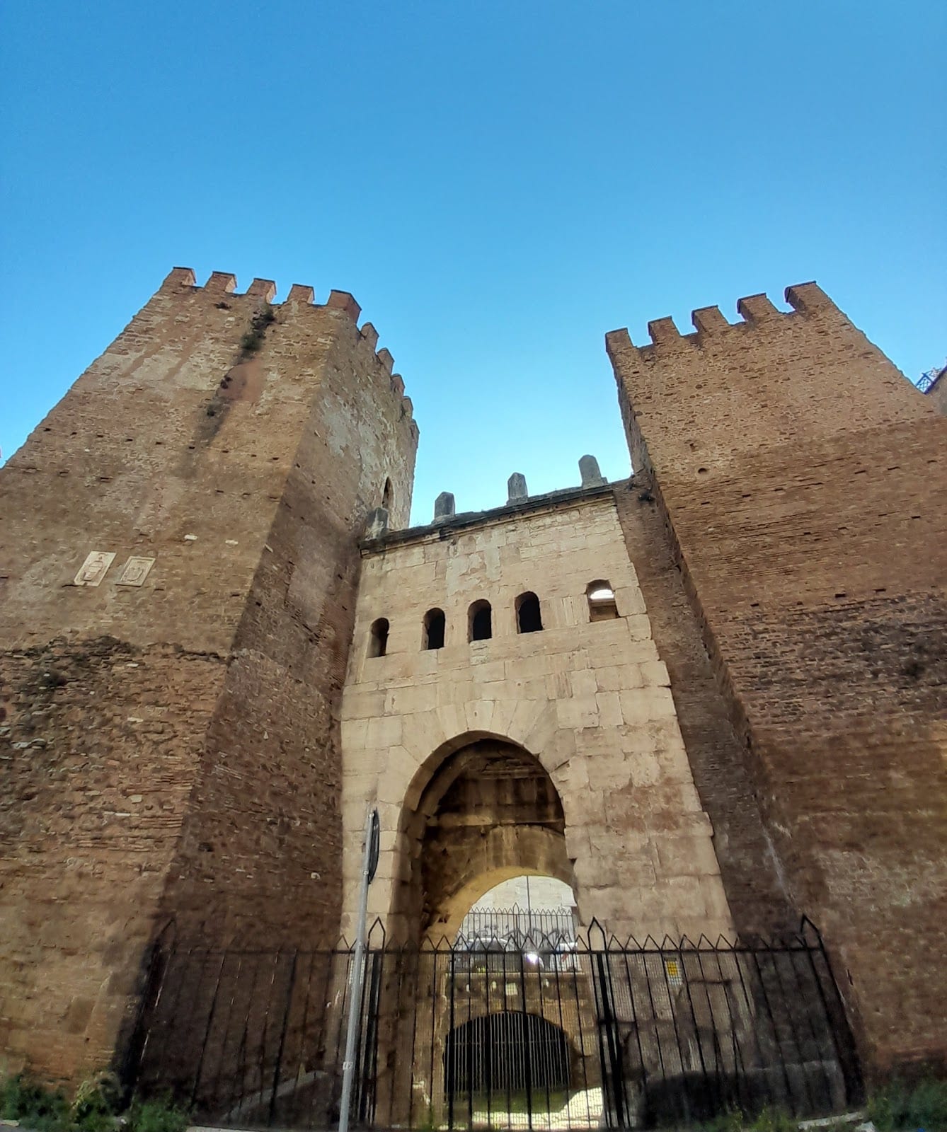 The crenellated twin towers of Porta Tiburtina in the Aurelian Walls.