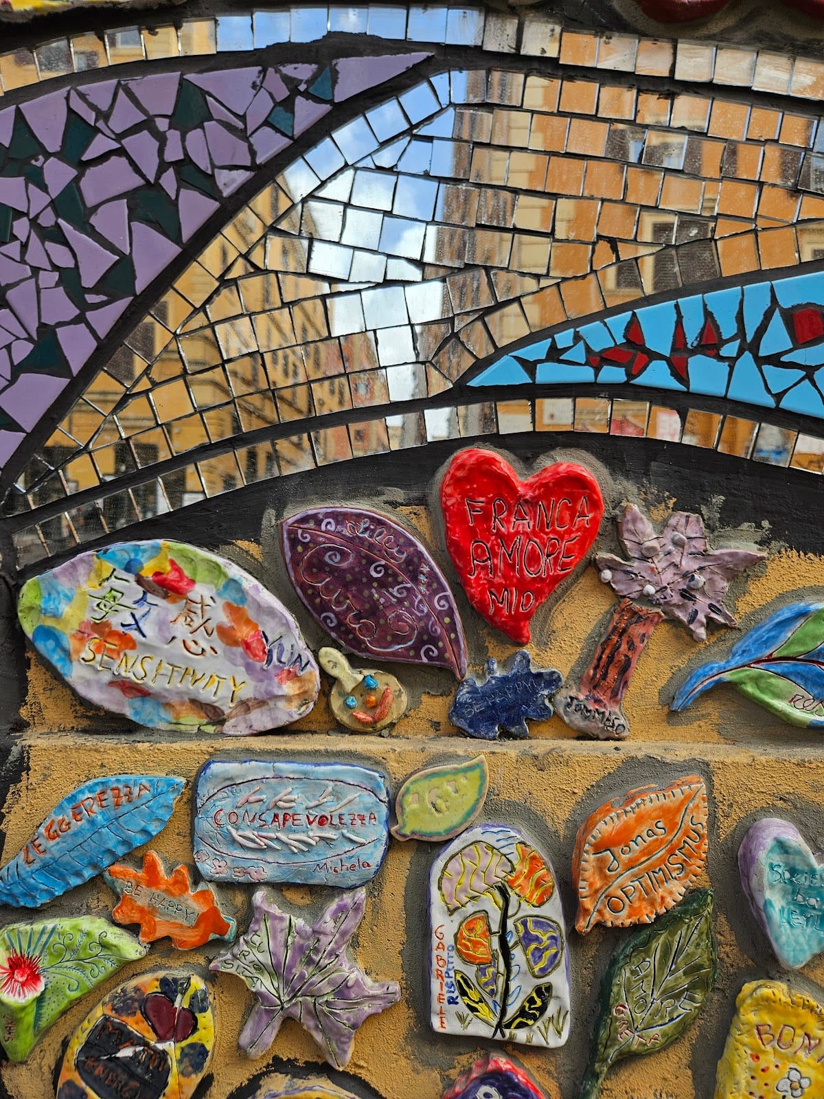 A colorful ceramic-and-mosaic street artwork in San Lorenzo, Rome.