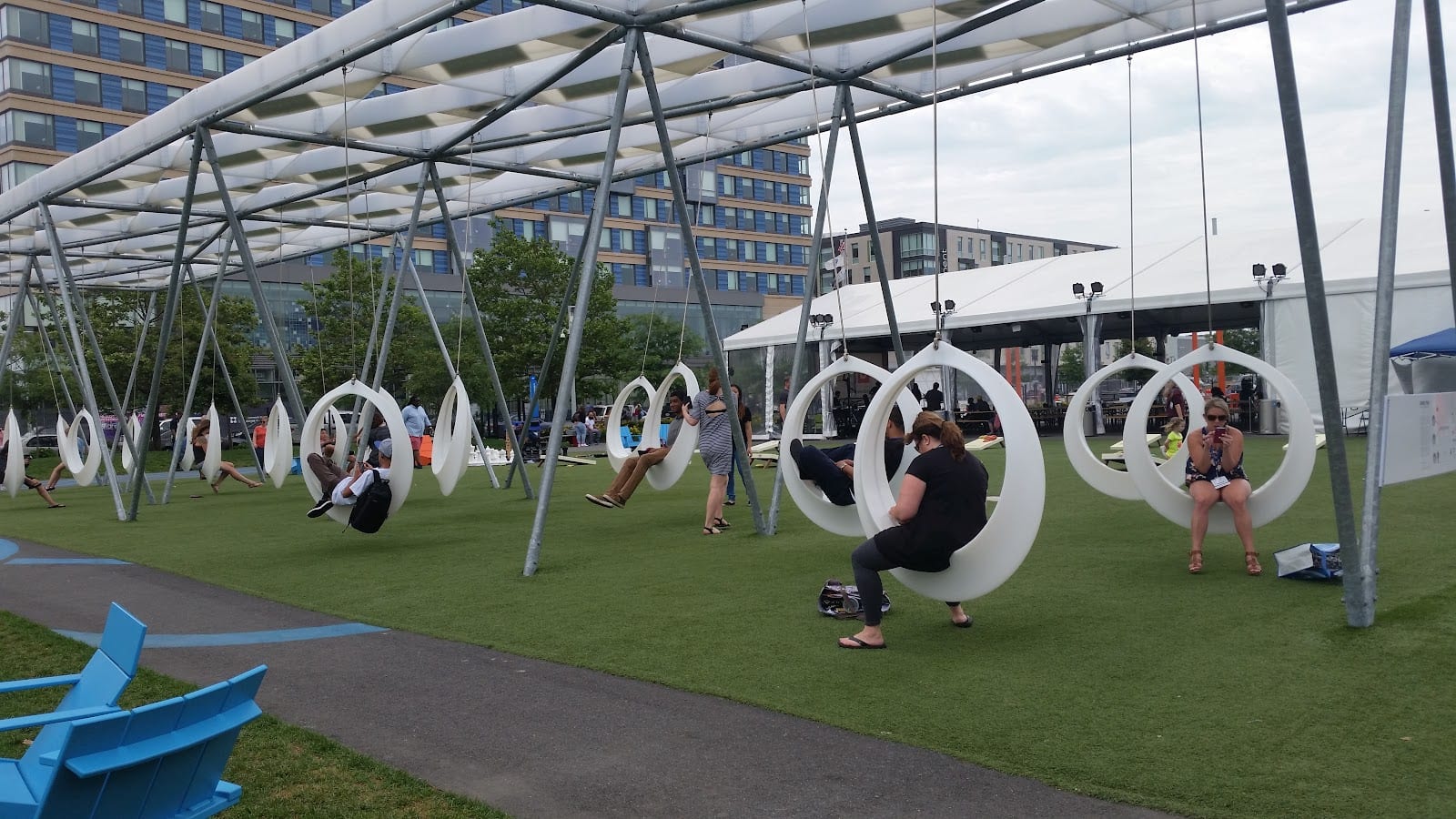 Lawn on D outdoor park with swing seats in Boston's Seaport.