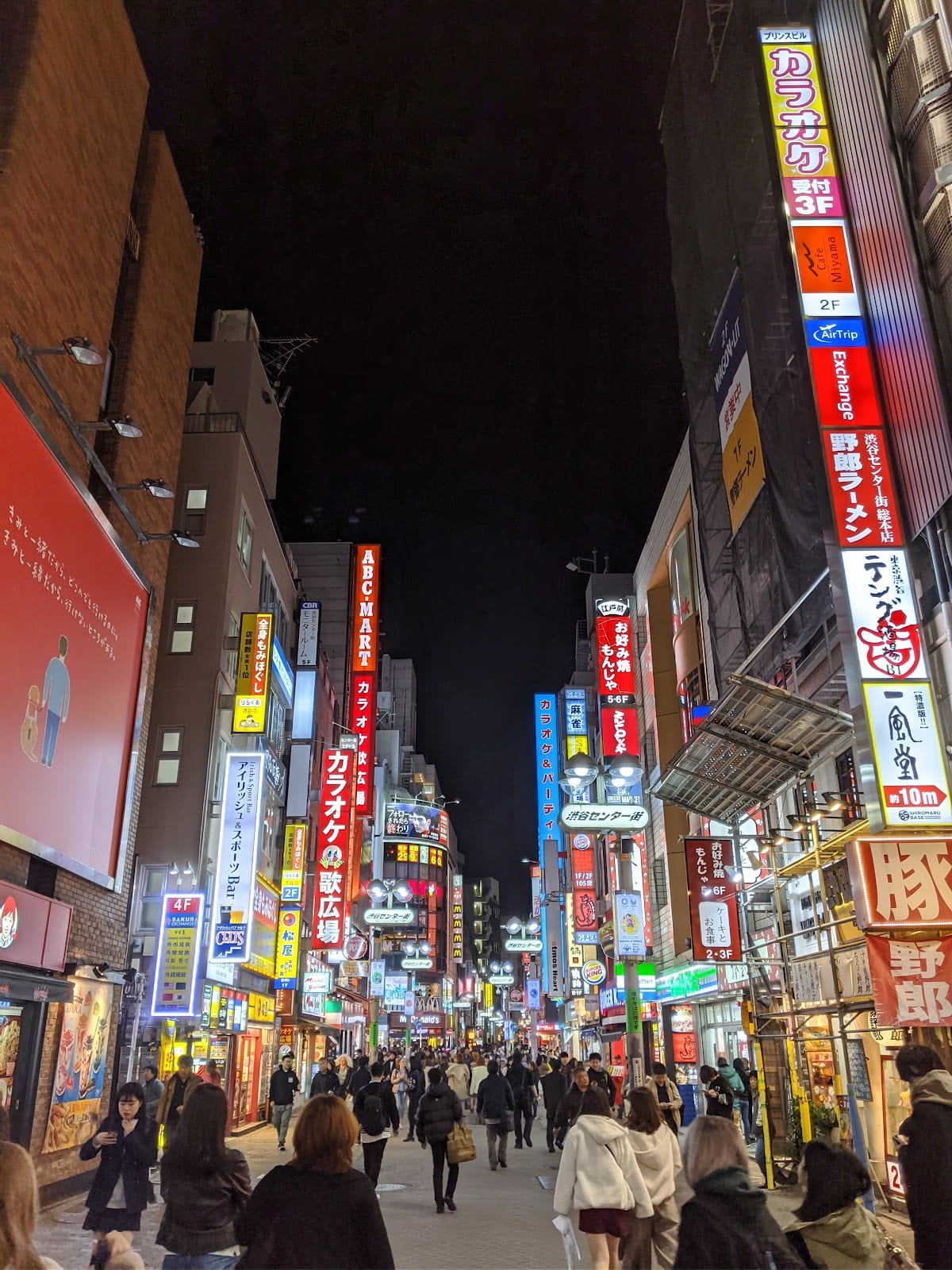 Center Gai glowing with signage after dark.
