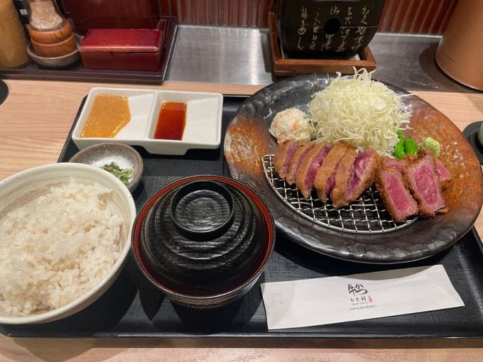Crisp-fried beef cutlet with rice and sides at Gyukatsu Motomura.