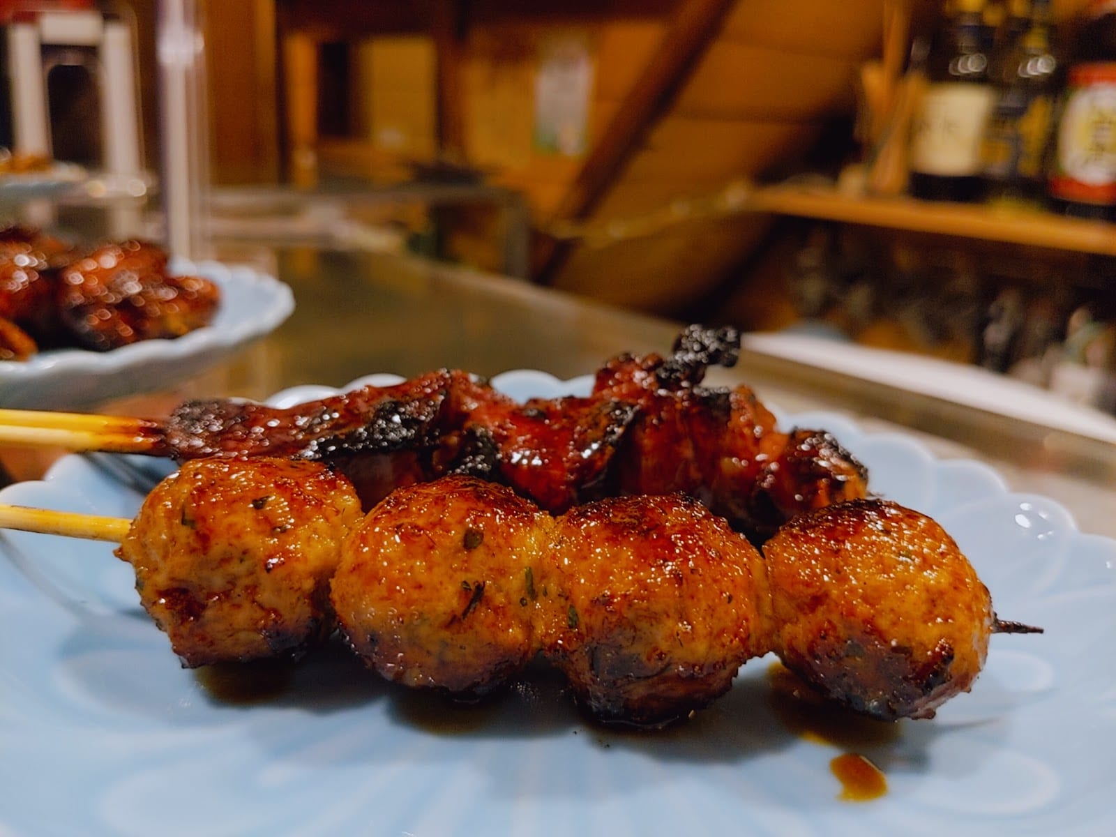 Grilled skewers served at a tiny Nonbei Yokocho bar.