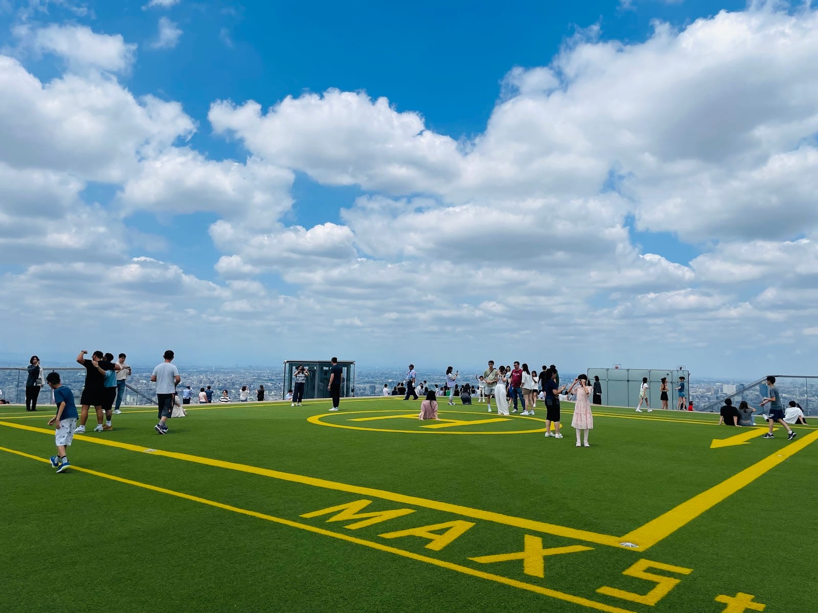 The open-air lawn on Shibuya Sky's rooftop deck.